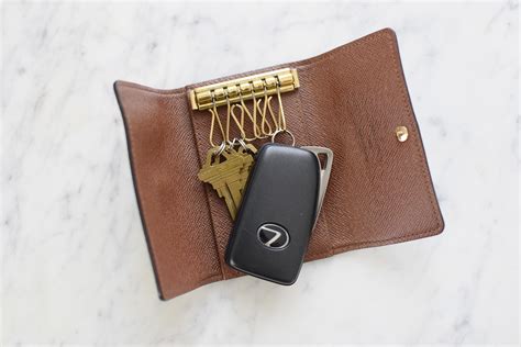 louis vuitton key pouch vs key holder|Louis Vuitton keychain card holder.